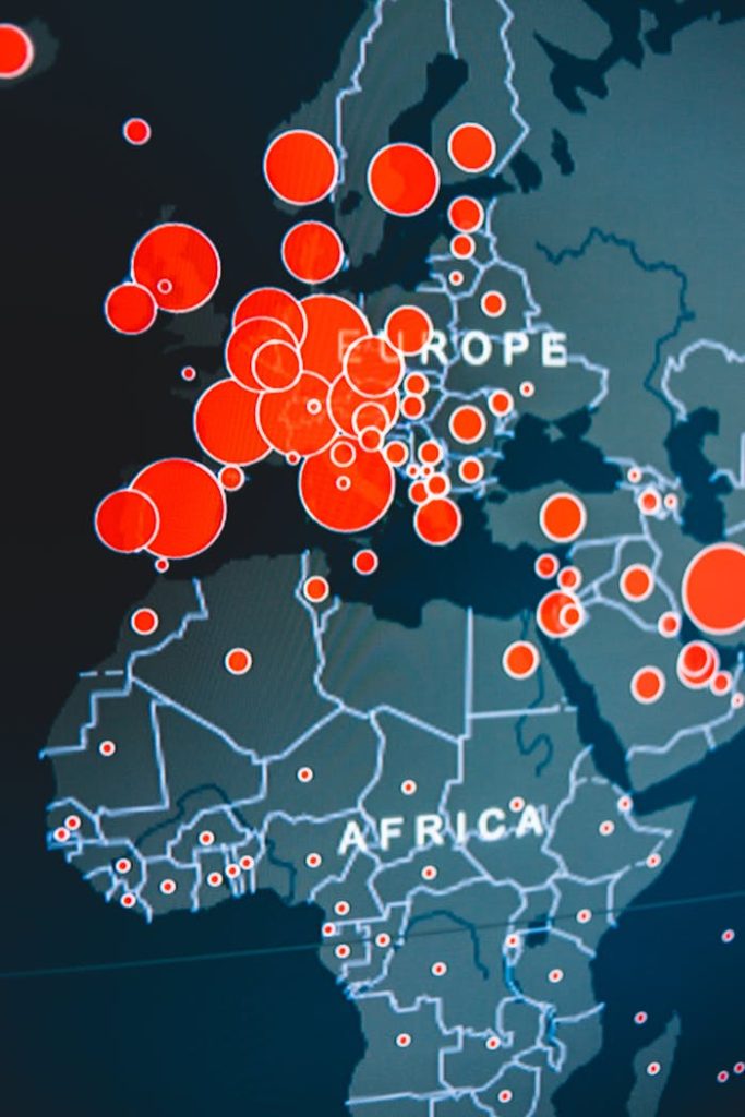 Vector image of digital map representing Africa and Europe continents with wavy lines and bright round marks on device screen